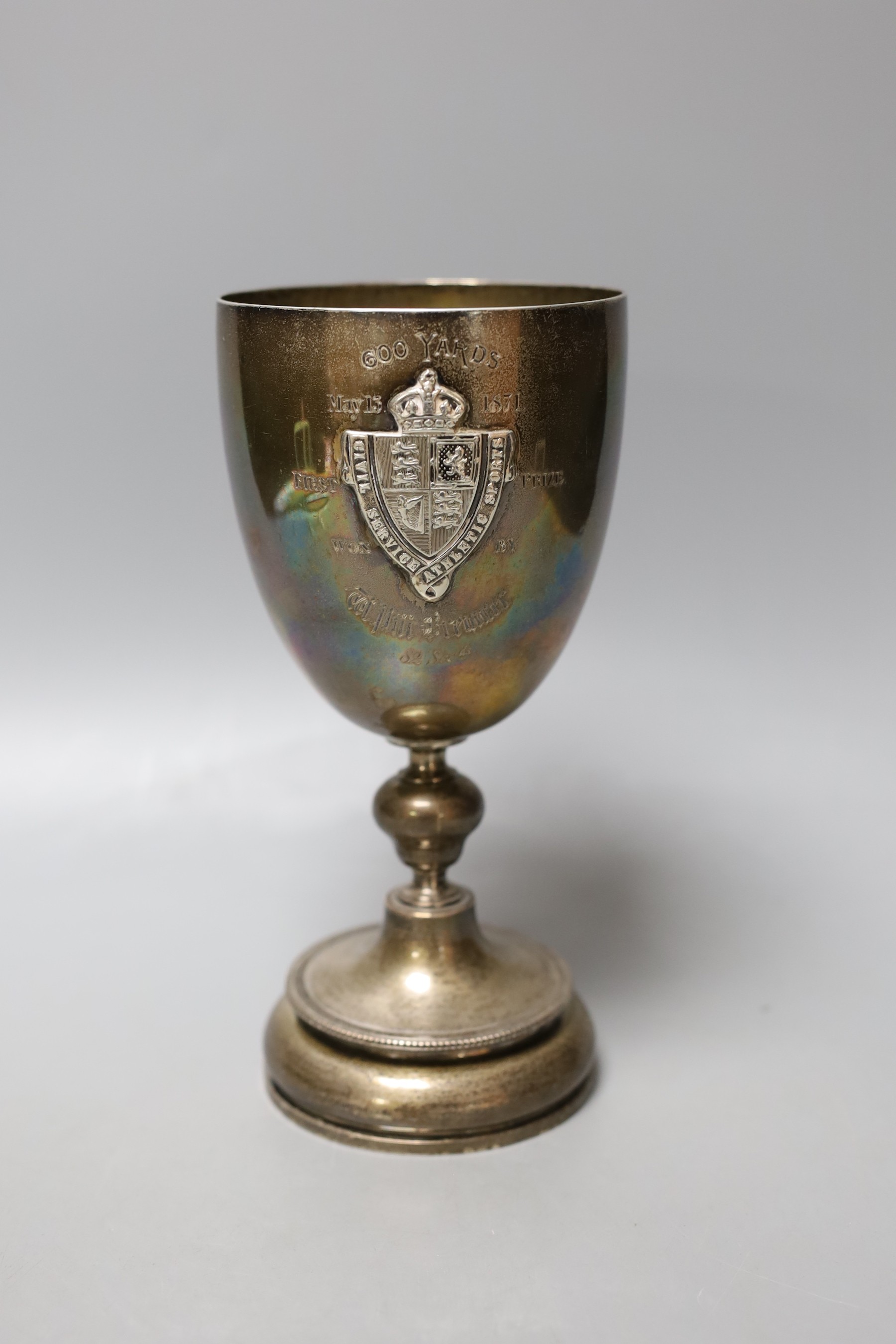 A Victorian silver presentation goblet, with engraved inscription and embossed panel, Daniel & Charles Houle, London, 1870, 19.6cm, 372 grams.